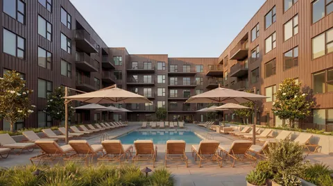 a swimming pool with outdoor seating and yard