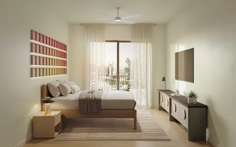 a spacious bedroom with a bed a couch and a large window