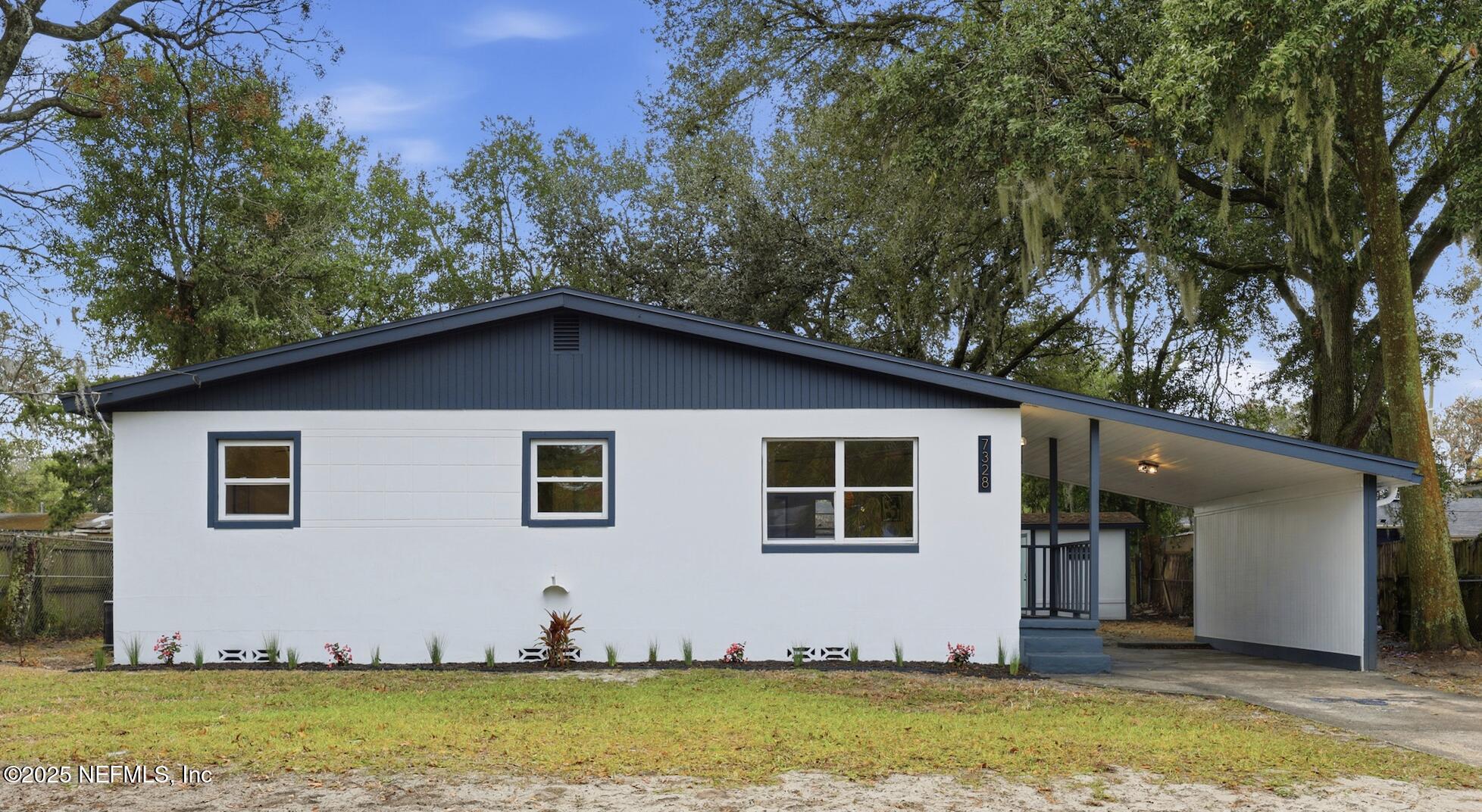 7328 Bamberg Road Jacksonville, FL 32277 - Photo 2 of 37 a view of a back yard of the house