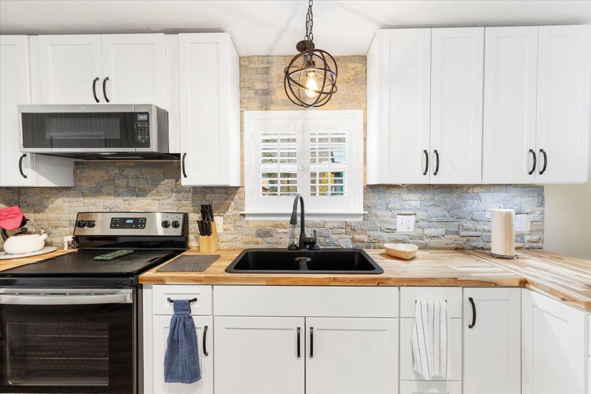 3729 Clark Road Hiwassee, VA 24347 - Photo 17 of 52 a kitchen with a sink cabinets and window