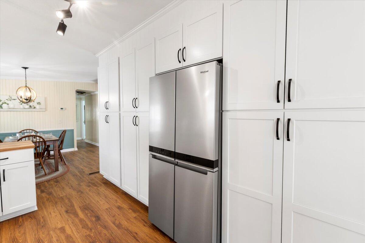 3729 Clark Road Hiwassee, VA 24347 - Photo 19 of 52 a kitchen with stainless steel appliances a refrigerator and wooden floor