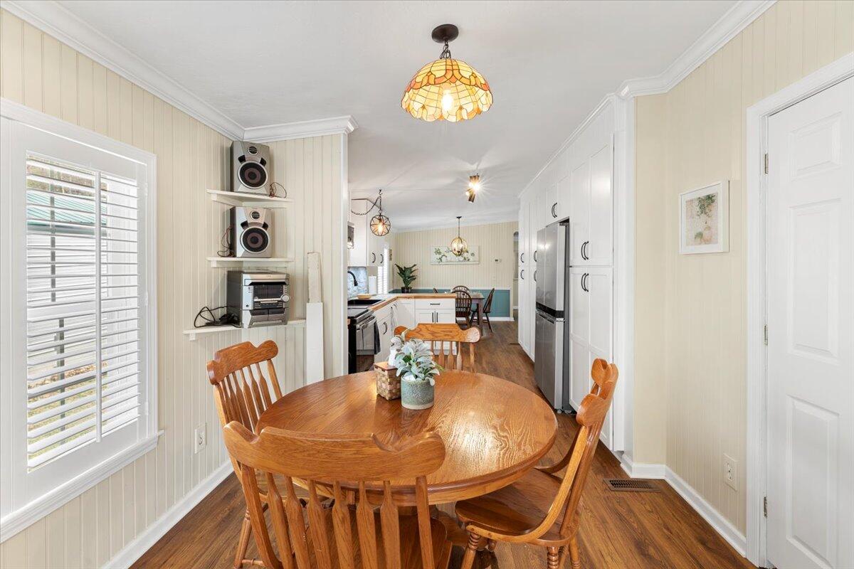 3729 Clark Road Hiwassee, VA 24347 - Photo 21 of 52 a view of a dining room with furniture and wooden floor
