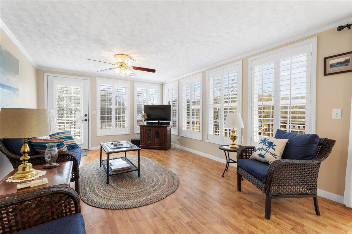 3729 Clark Road Hiwassee, VA 24347 - Photo 23 of 52 a living room with furniture a flat screen tv and a large window