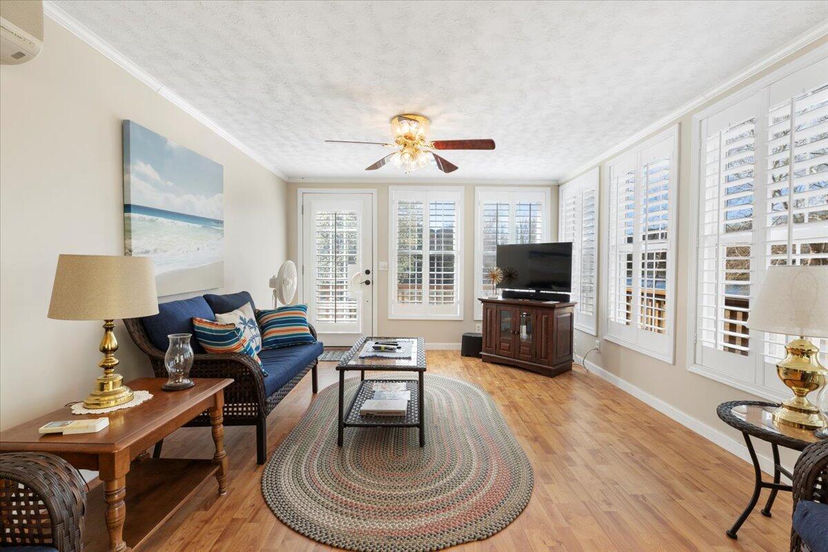 3729 Clark Road Hiwassee, VA 24347 - Photo 24 of 52 a living room with furniture a large window and a flat screen tv