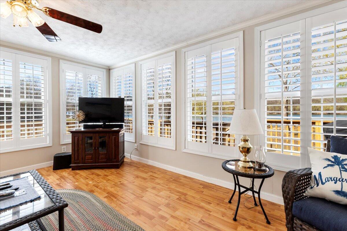 3729 Clark Road Hiwassee, VA 24347 - Photo 25 of 52 a living room with furniture and a flat screen tv with wooden floor