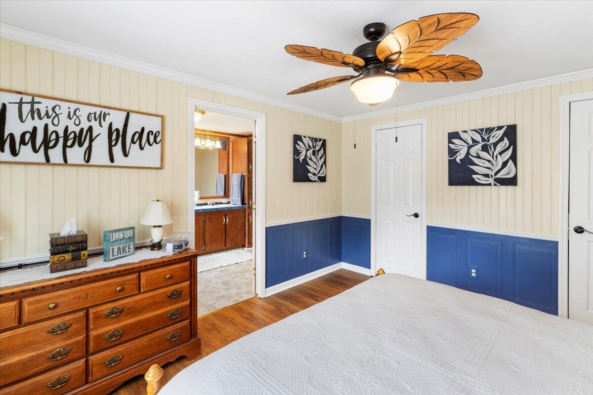 3729 Clark Road Hiwassee, VA 24347 - Photo 29 of 52 a bedroom with a bed and a dresser in it