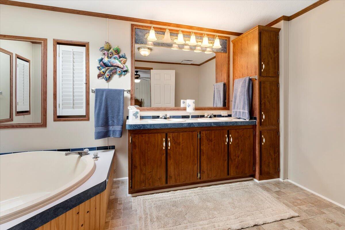 3729 Clark Road Hiwassee, VA 24347 - Photo 30 of 52 a bathroom with a granite countertop sink and a mirror