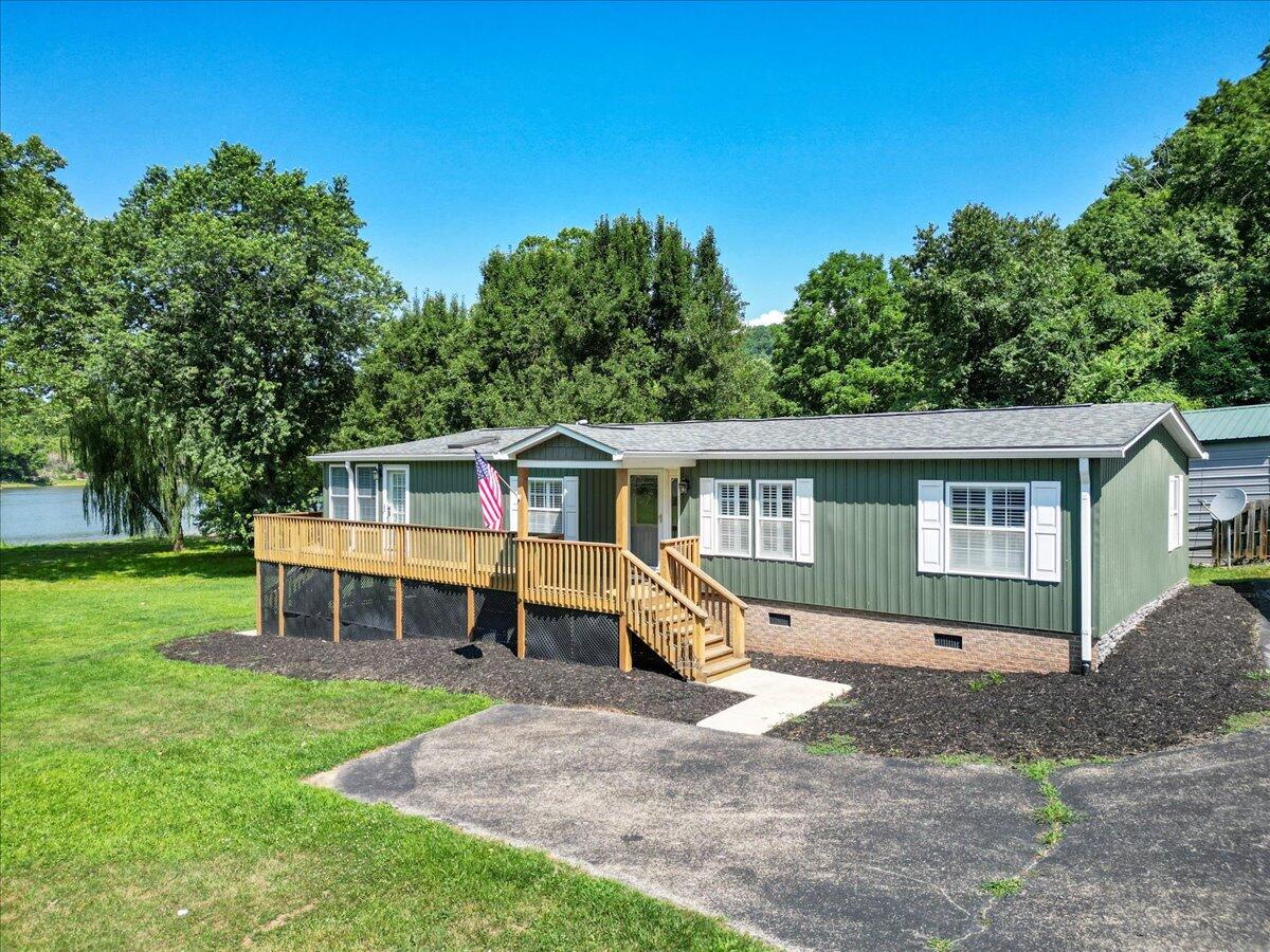 3729 Clark Road Hiwassee, VA 24347 - Photo 3 of 52 a front view of a house with a garden