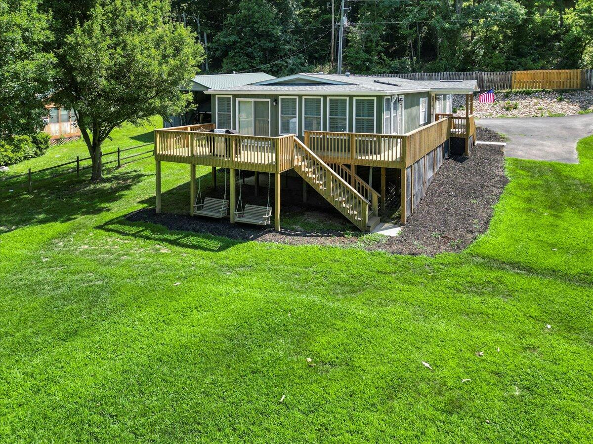 3729 Clark Road Hiwassee, VA 24347 - Photo 42 of 52 a view of a house with a yard deck and a garden