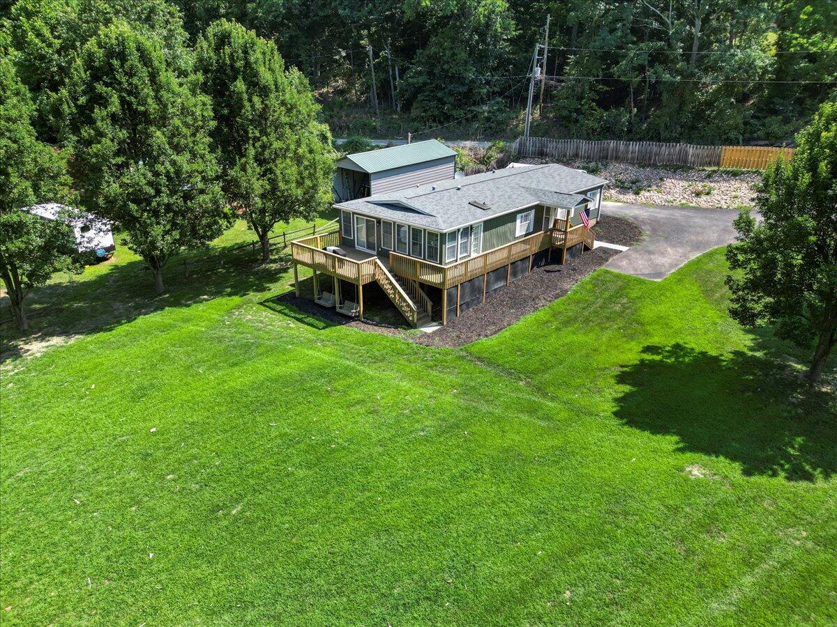 3729 Clark Road Hiwassee, VA 24347 - Photo 52 of 52 an aerial view of a house with backyard garden and outdoor seating