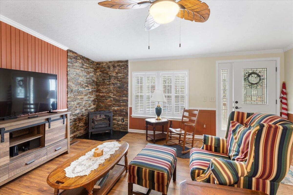 3729 Clark Road Hiwassee, VA 24347 - Photo 9 of 52 a living room with furniture a flat screen tv and kitchen view