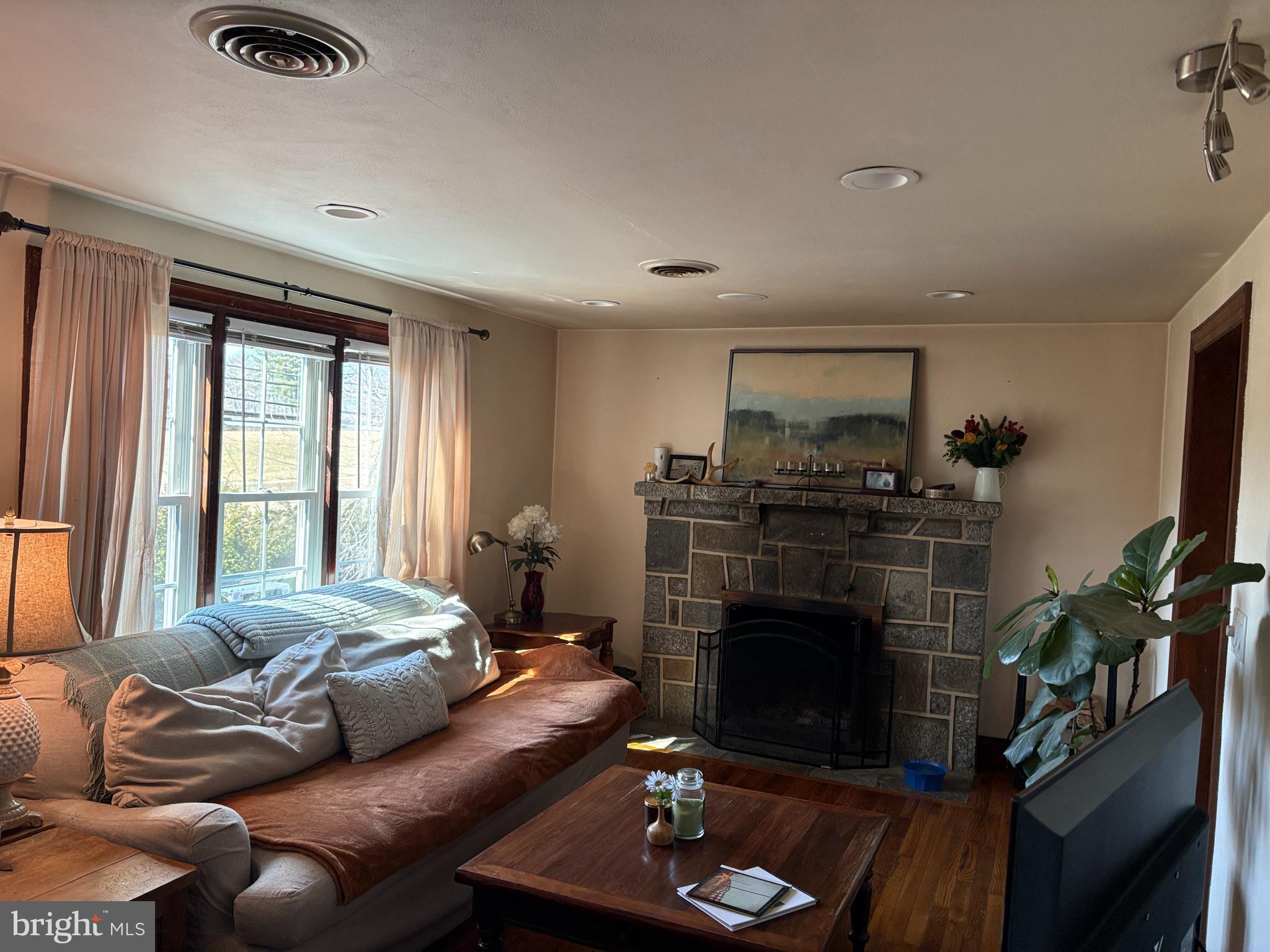 2398 Frenchtown Road Port Deposit, MD 21904 - Photo 13 of 17 a living room with furniture fireplace and flat screen tv