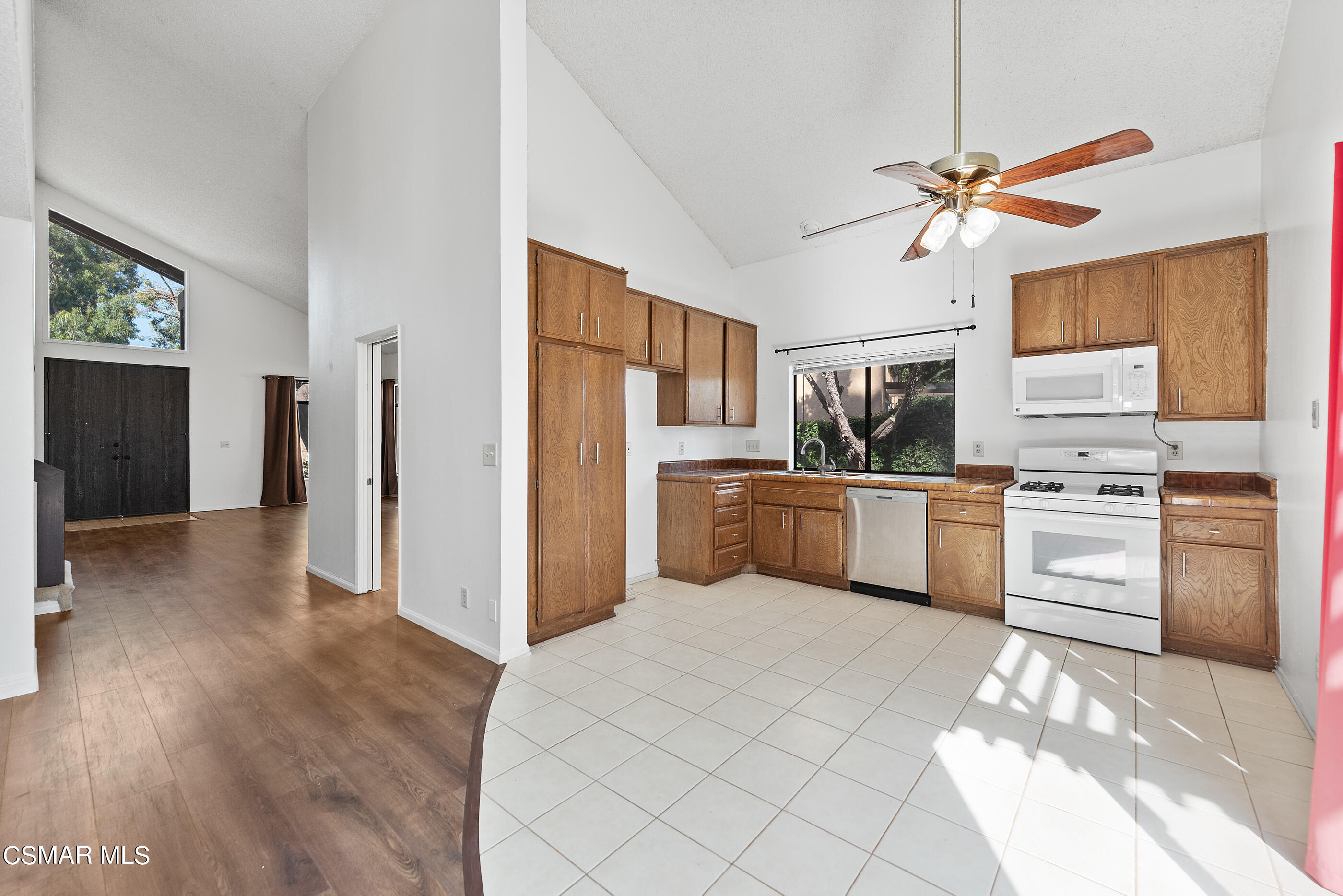 837 Hillview Circle Simi Valley, CA 93065 - Photo 11 of 42 a kitchen with white cabinets and stainless steel appliances