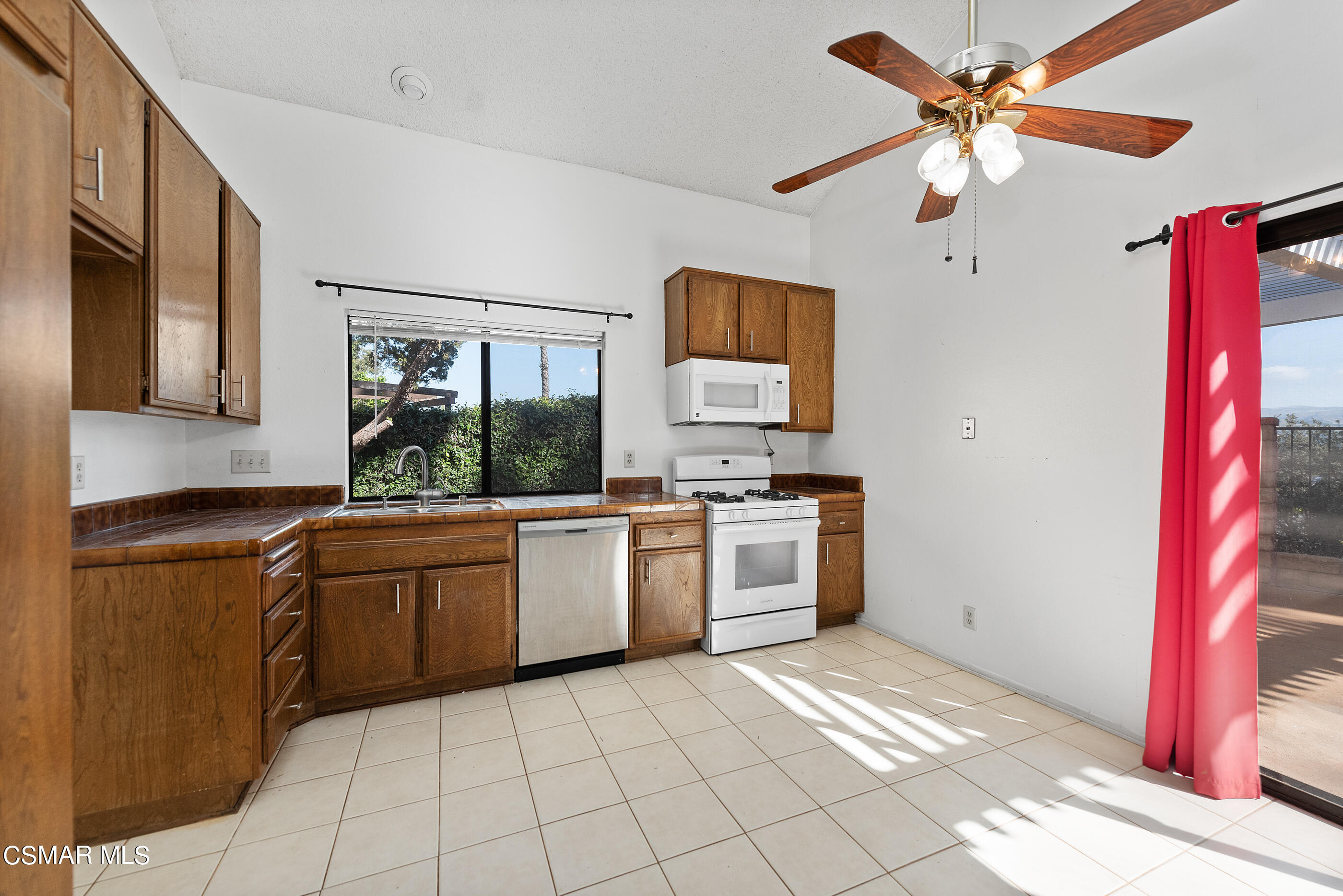 837 Hillview Circle Simi Valley, CA 93065 - Photo 12 of 42 a large kitchen with stainless steel appliances granite countertop a stove a sink and a refrigerator
