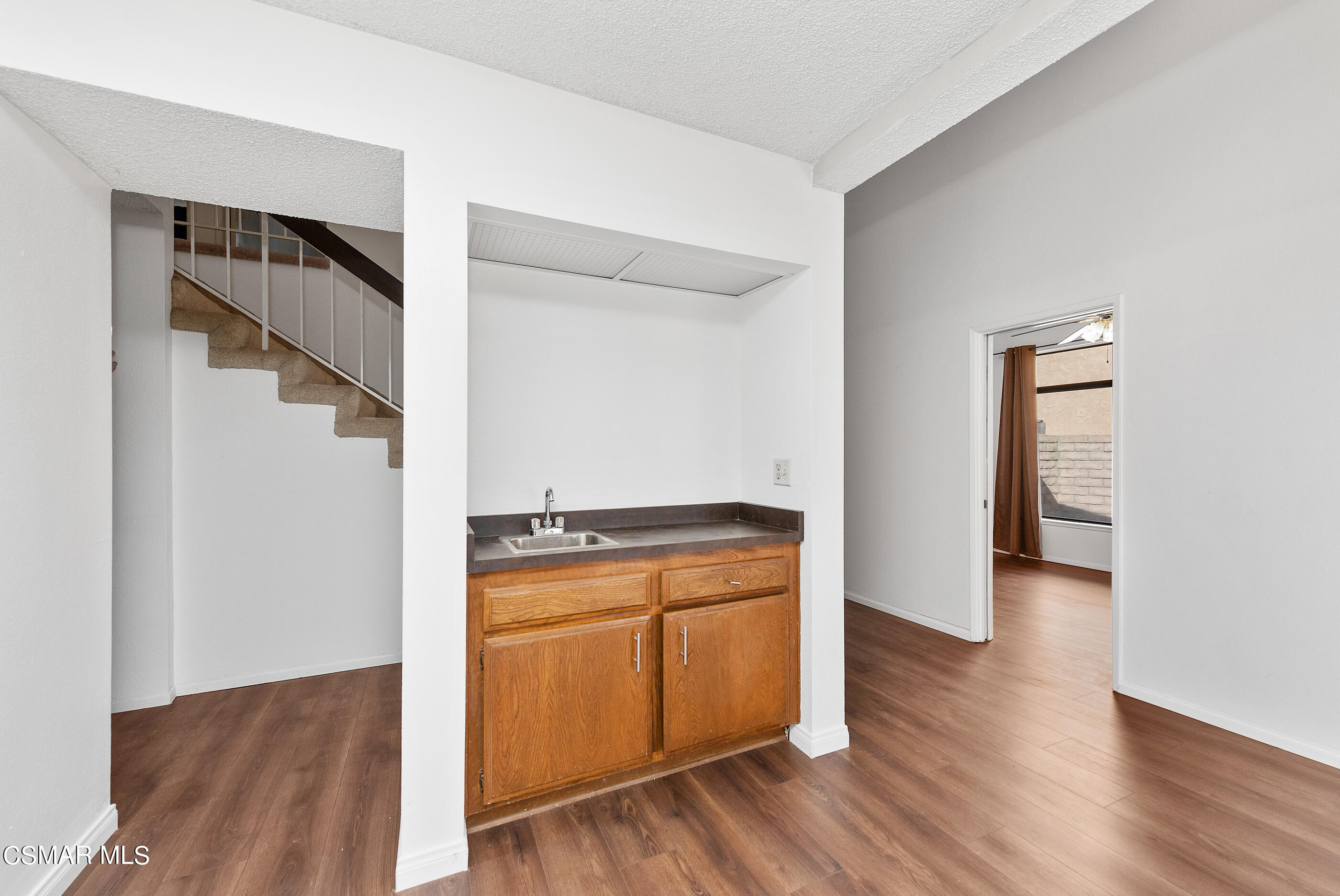 837 Hillview Circle Simi Valley, CA 93065 - Photo 15 of 42 a view of a kitchen with a white cabinet and a stove top oven