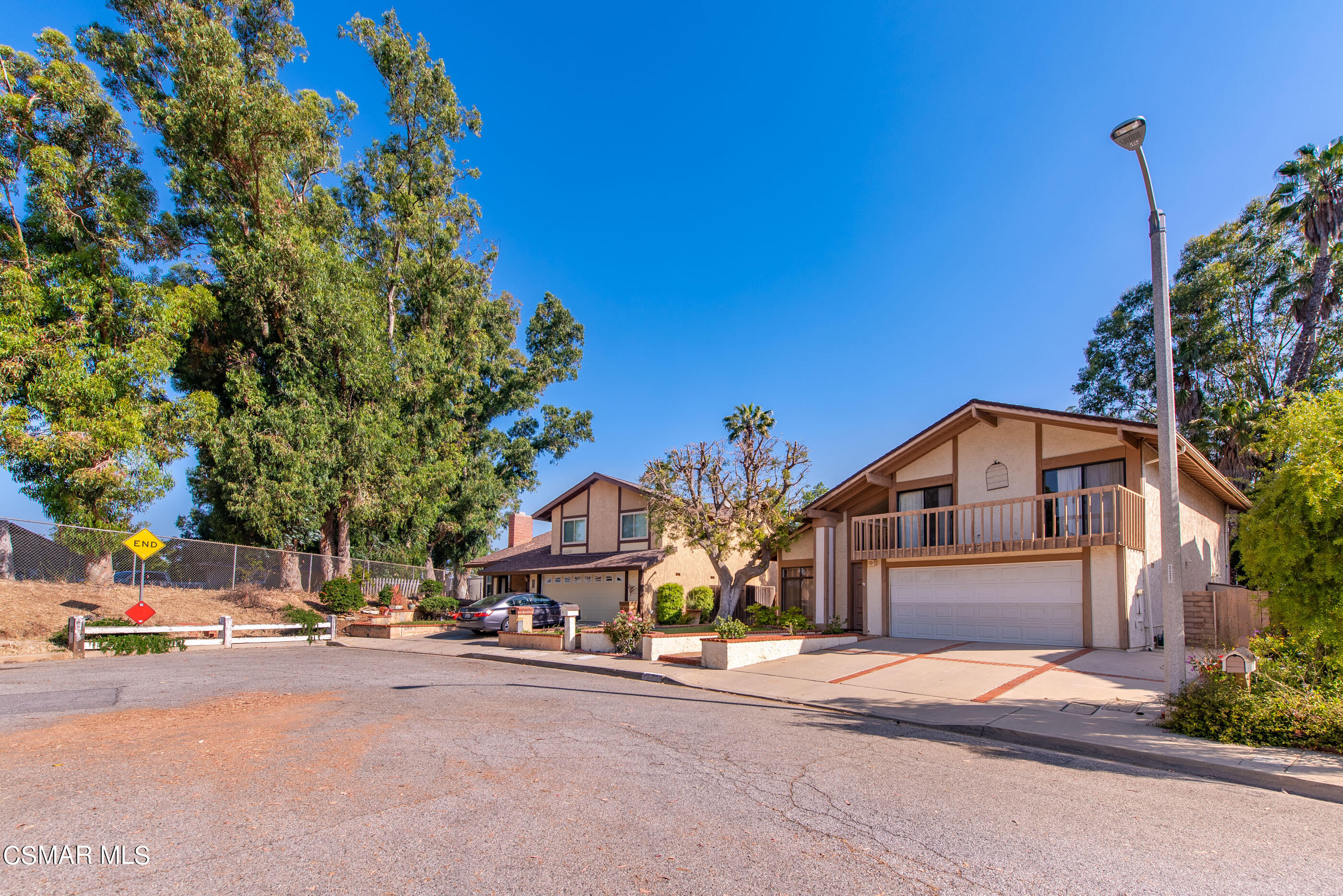 837 Hillview Circle Simi Valley, CA 93065 - Photo 2 of 42 a front view of a house with a yard and garage