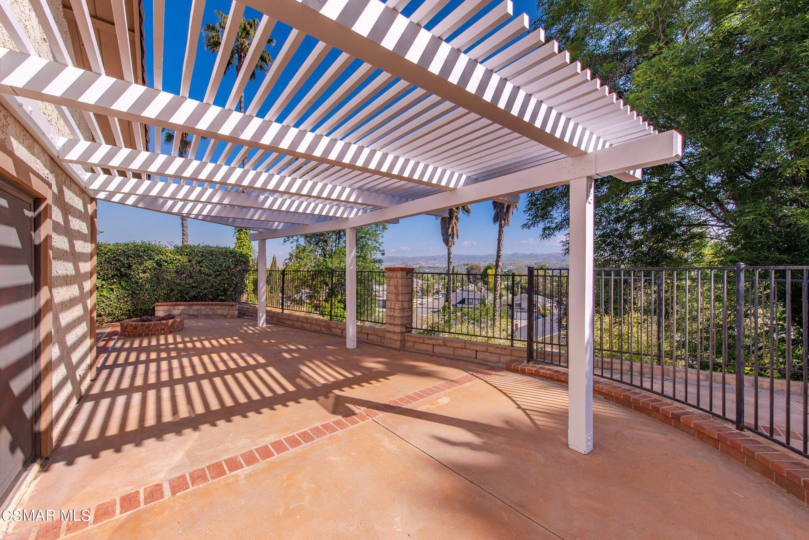 837 Hillview Circle Simi Valley, CA 93065 - Photo 39 of 42 a view of a patio with a table chairs and a backyard