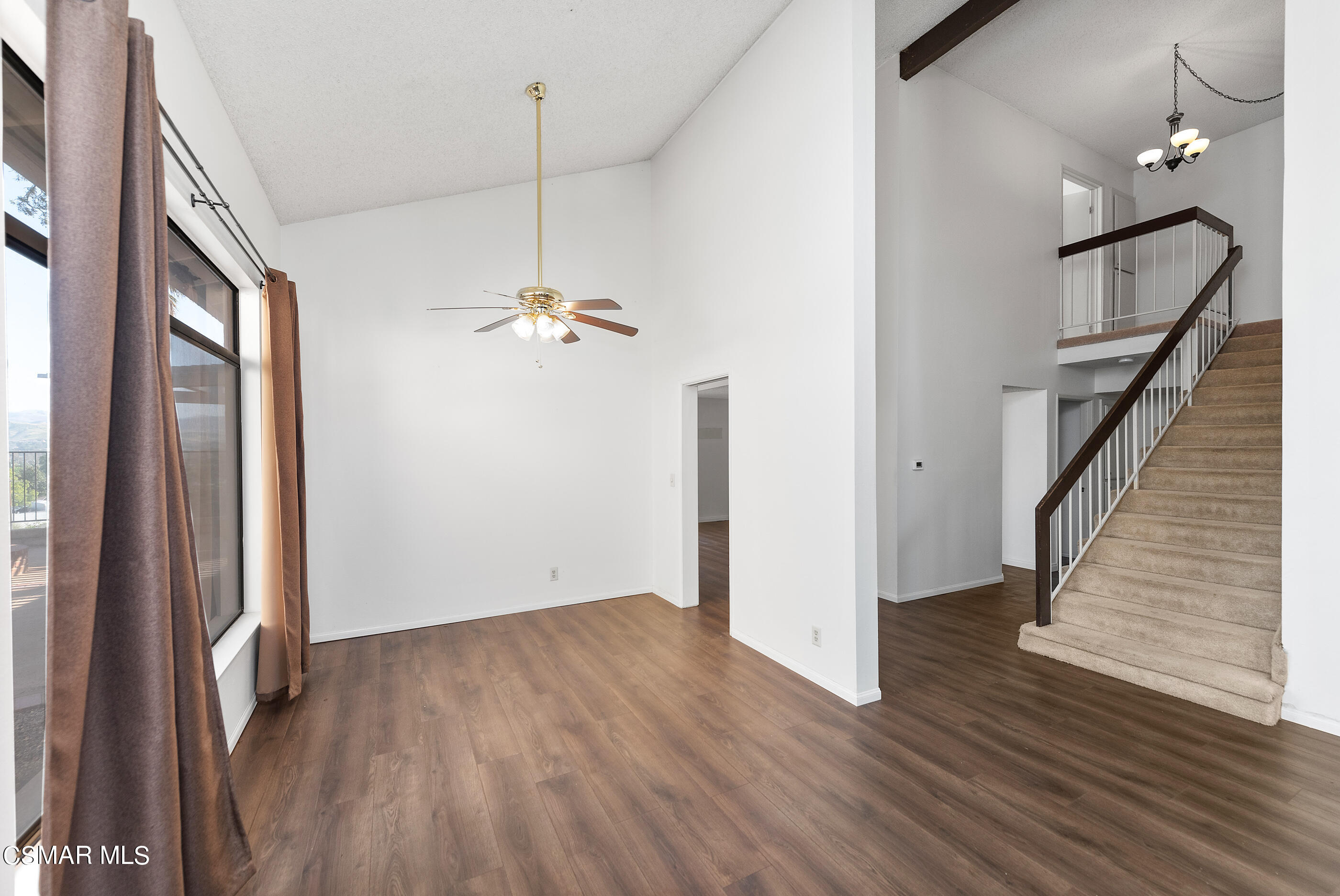 837 Hillview Circle Simi Valley, CA 93065 - Photo 6 of 42 a view of a hallway with wooden floor and stairs