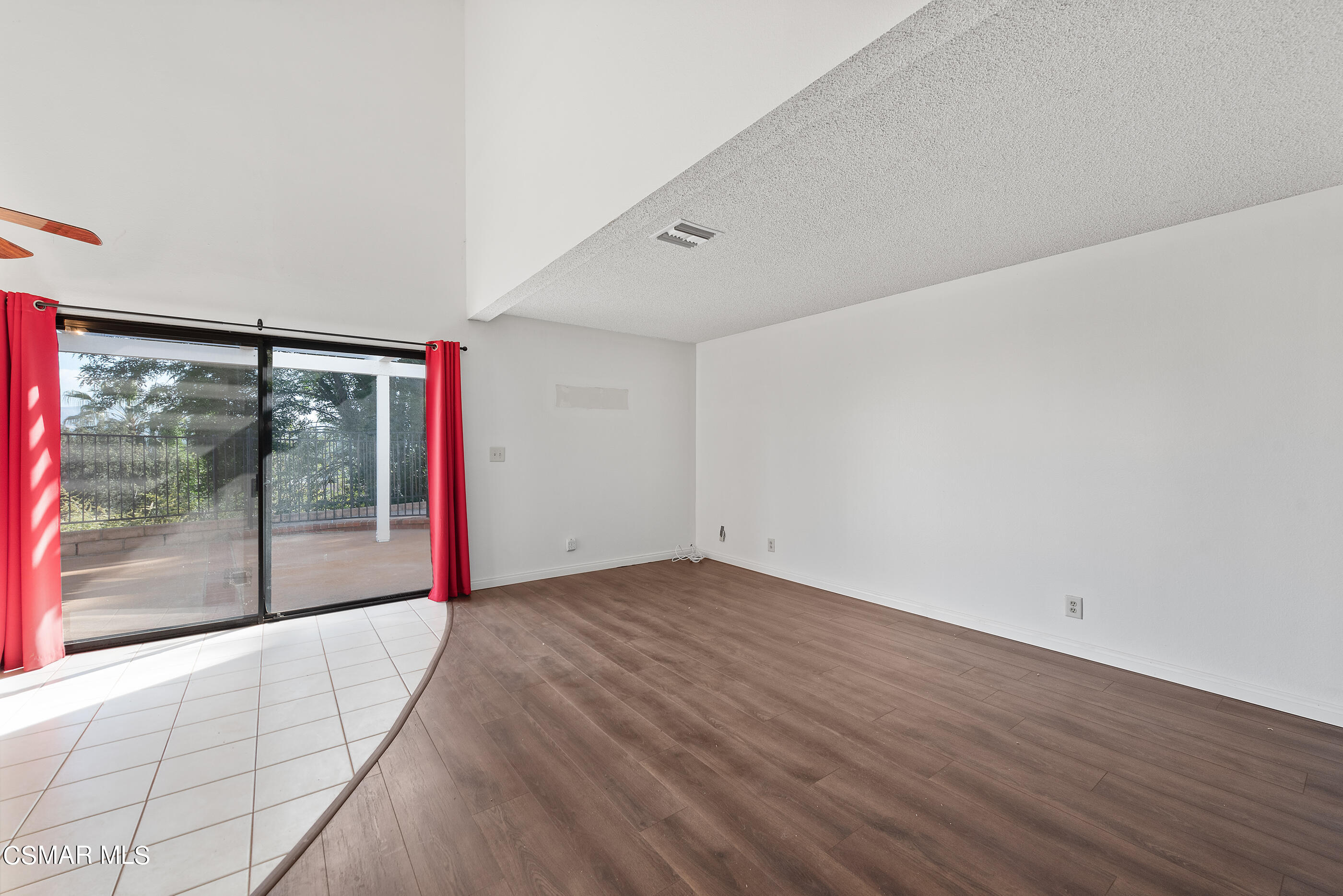 837 Hillview Circle Simi Valley, CA 93065 - Photo 8 of 42 a view of an empty room with wooden floor and a window