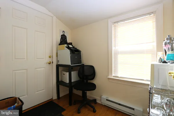 a living room with furniture and a chair