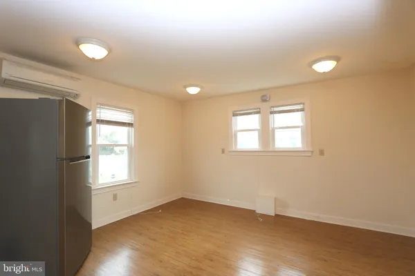 a bedroom with bed and a window