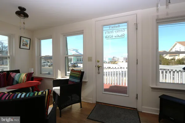 a view of a balcony with wooden floor