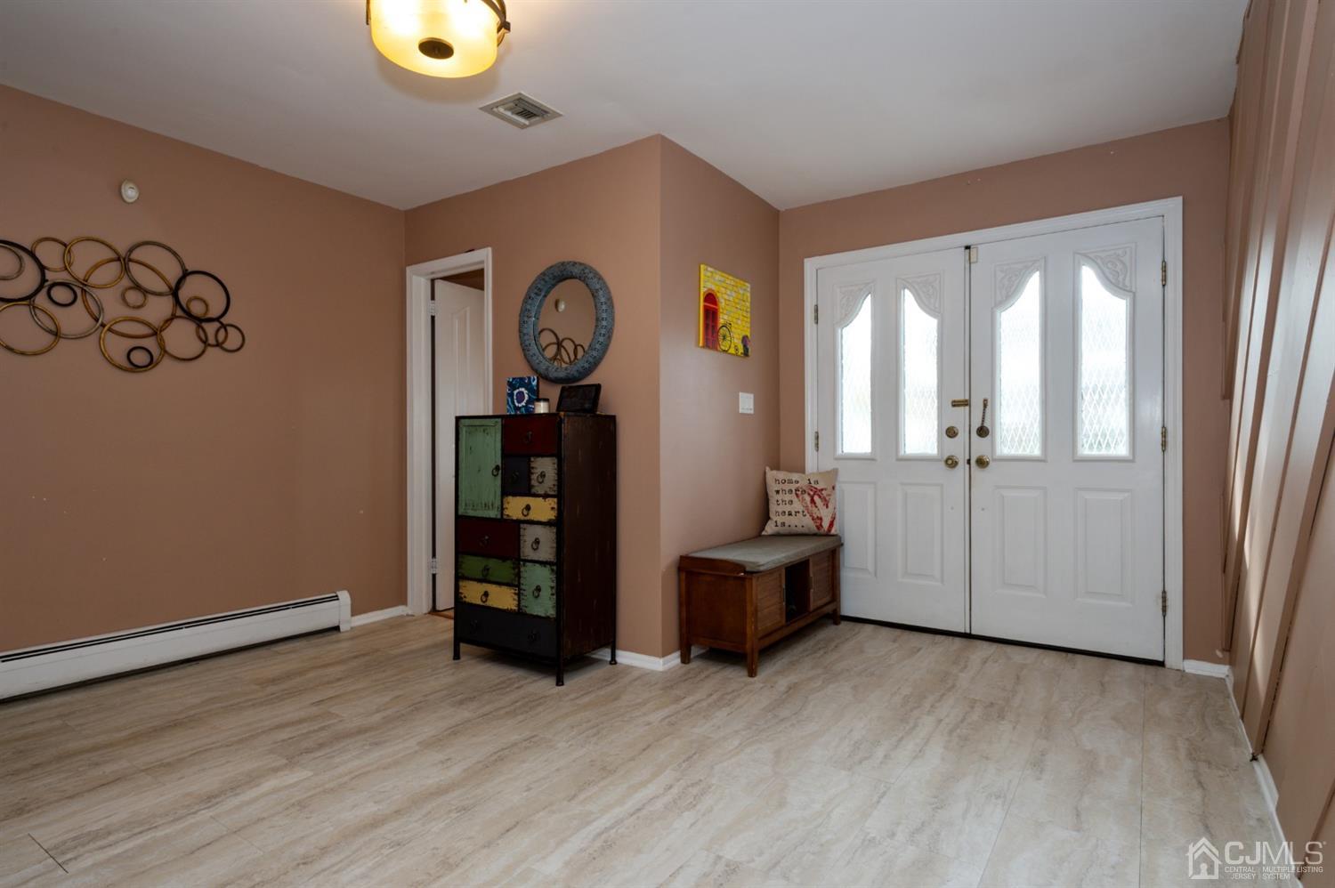 37 Lynnwood Road Edison, NJ 08820 - Photo 2 of 20 an empty room with wooden floor and windows