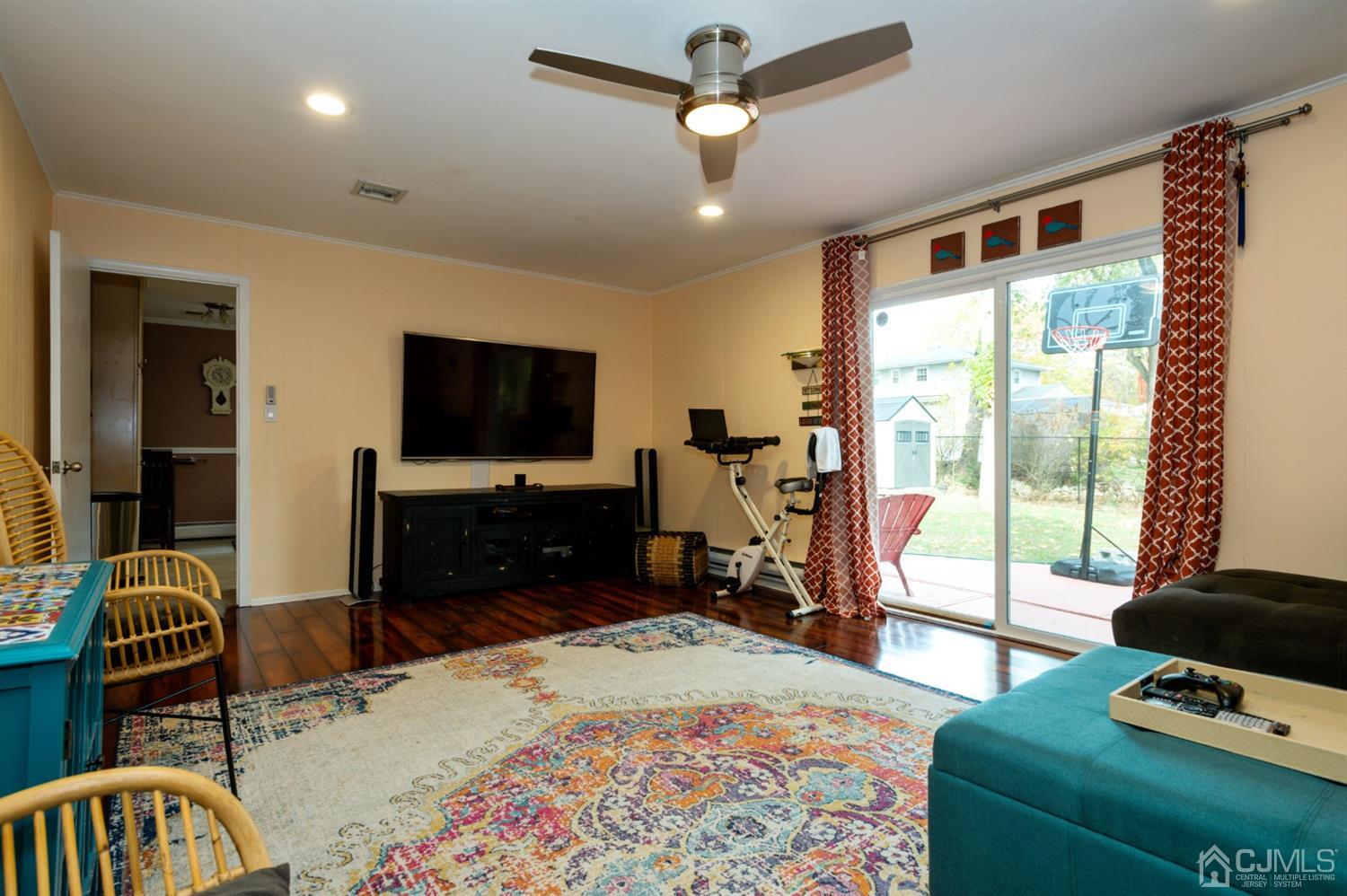 37 Lynnwood Road Edison, NJ 08820 - Photo 11 of 20 a living room with a bed furniture and a flat tv screen