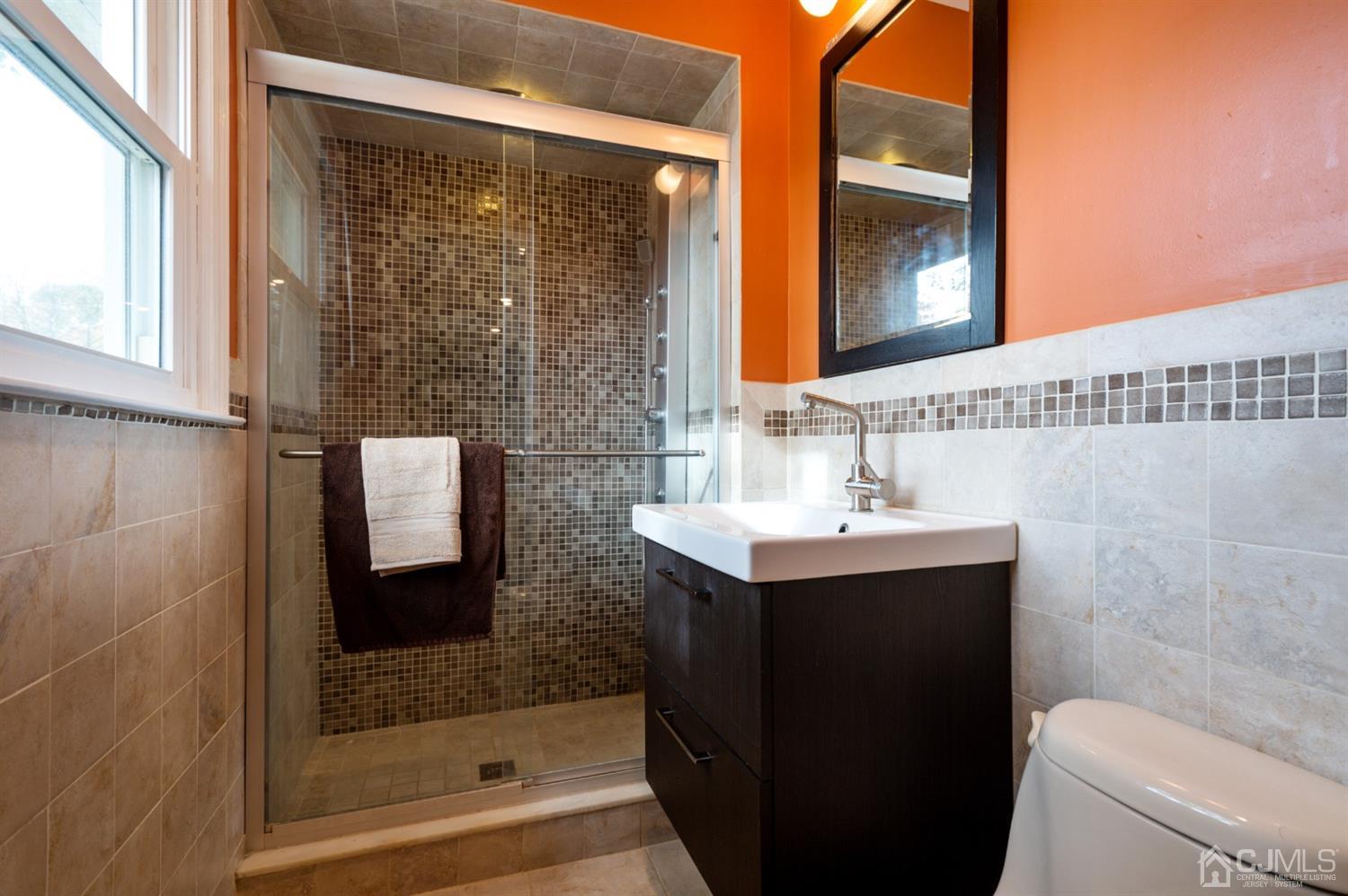 37 Lynnwood Road Edison, NJ 08820 - Photo 13 of 20 a bathroom with a sink a toilet and shower