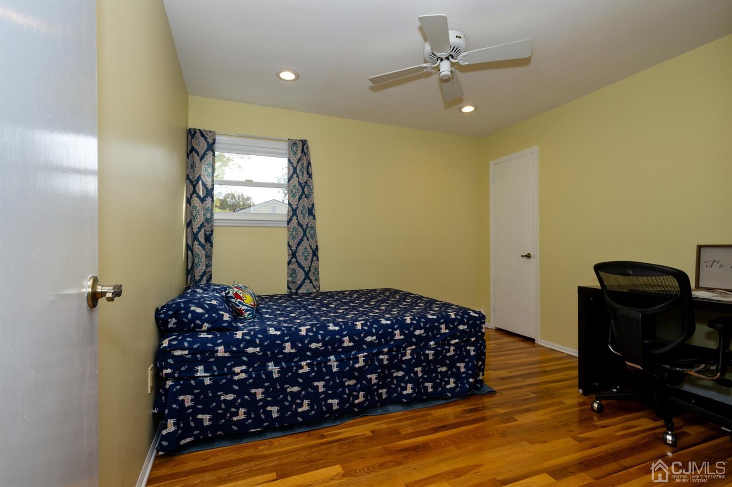 37 Lynnwood Road Edison, NJ 08820 - Photo 14 of 20 a bedroom with a bed and wooden floor