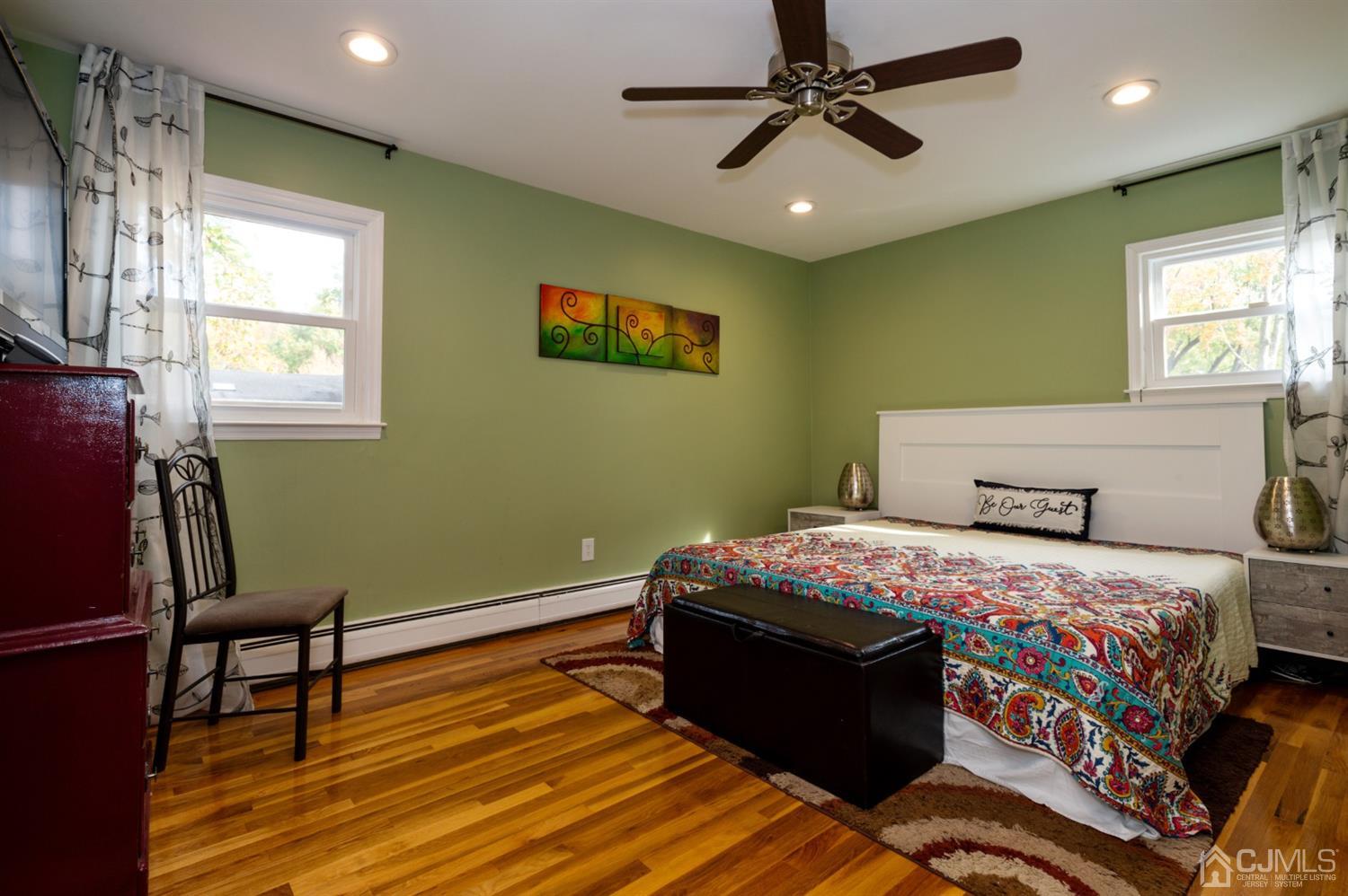 37 Lynnwood Road Edison, NJ 08820 - Photo 15 of 20 a bedroom with a bed and a chandelier