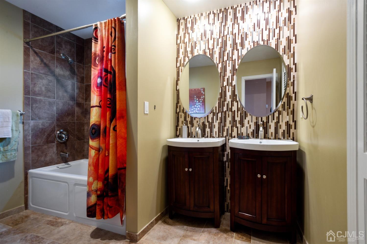 37 Lynnwood Road Edison, NJ 08820 - Photo 17 of 20 a bathroom with a sink and a mirror