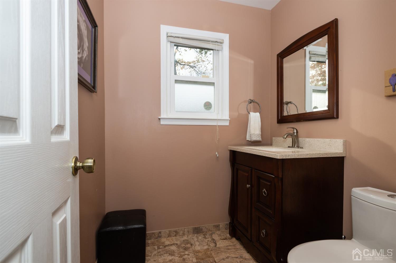37 Lynnwood Road Edison, NJ 08820 - Photo 18 of 20 a bathroom with a sink toilet and mirror