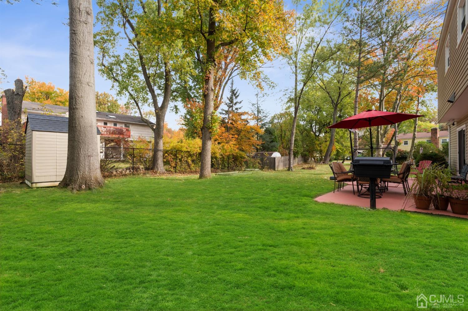 37 Lynnwood Road Edison, NJ 08820 - Photo 20 of 20 a view of a park with bench and a tree