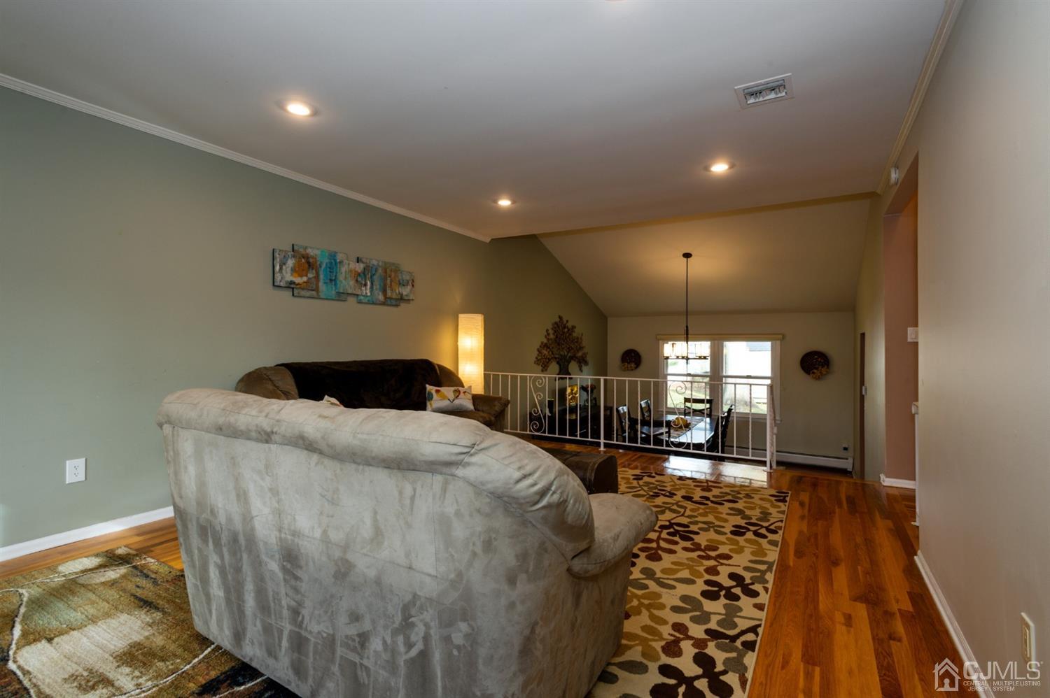 37 Lynnwood Road Edison, NJ 08820 - Photo 4 of 20 a living room with furniture and a chandelier