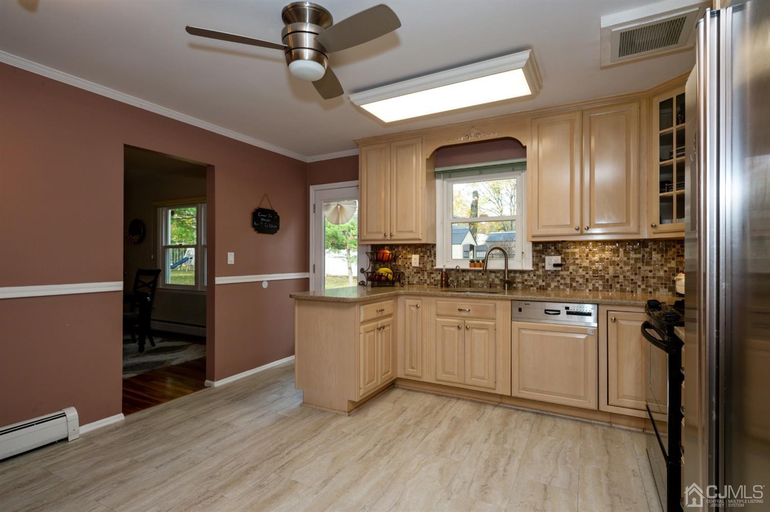 37 Lynnwood Road Edison, NJ 08820 - Photo 6 of 20 a kitchen with cabinets and wooden floor
