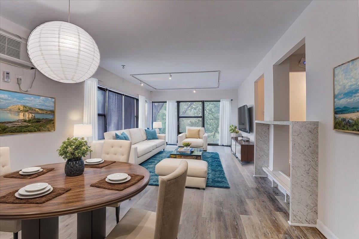 232 South Highland Street, Unit 409 Memphis, TN 38111 - Photo 12 of 39 a living room with furniture potted plant and a large window
