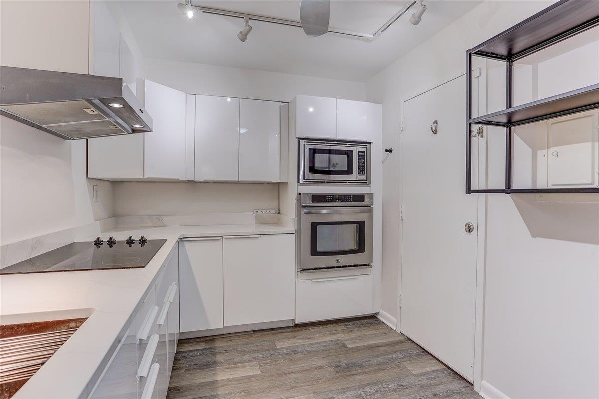 232 South Highland Street, Unit 409 Memphis, TN 38111 - Photo 16 of 39 a kitchen with stainless steel appliances cabinets a stove and a refrigerator