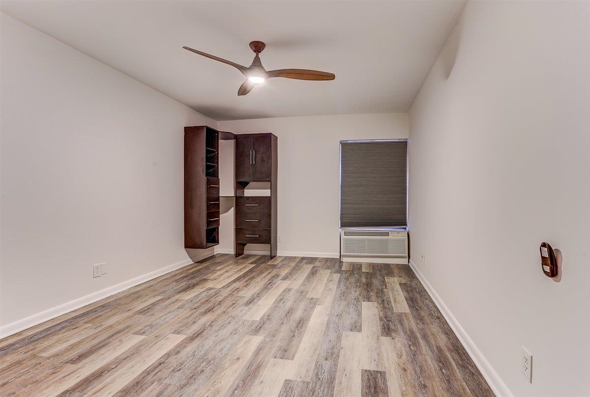 232 South Highland Street, Unit 409 Memphis, TN 38111 - Photo 19 of 39 wooden floor in an empty room with a window