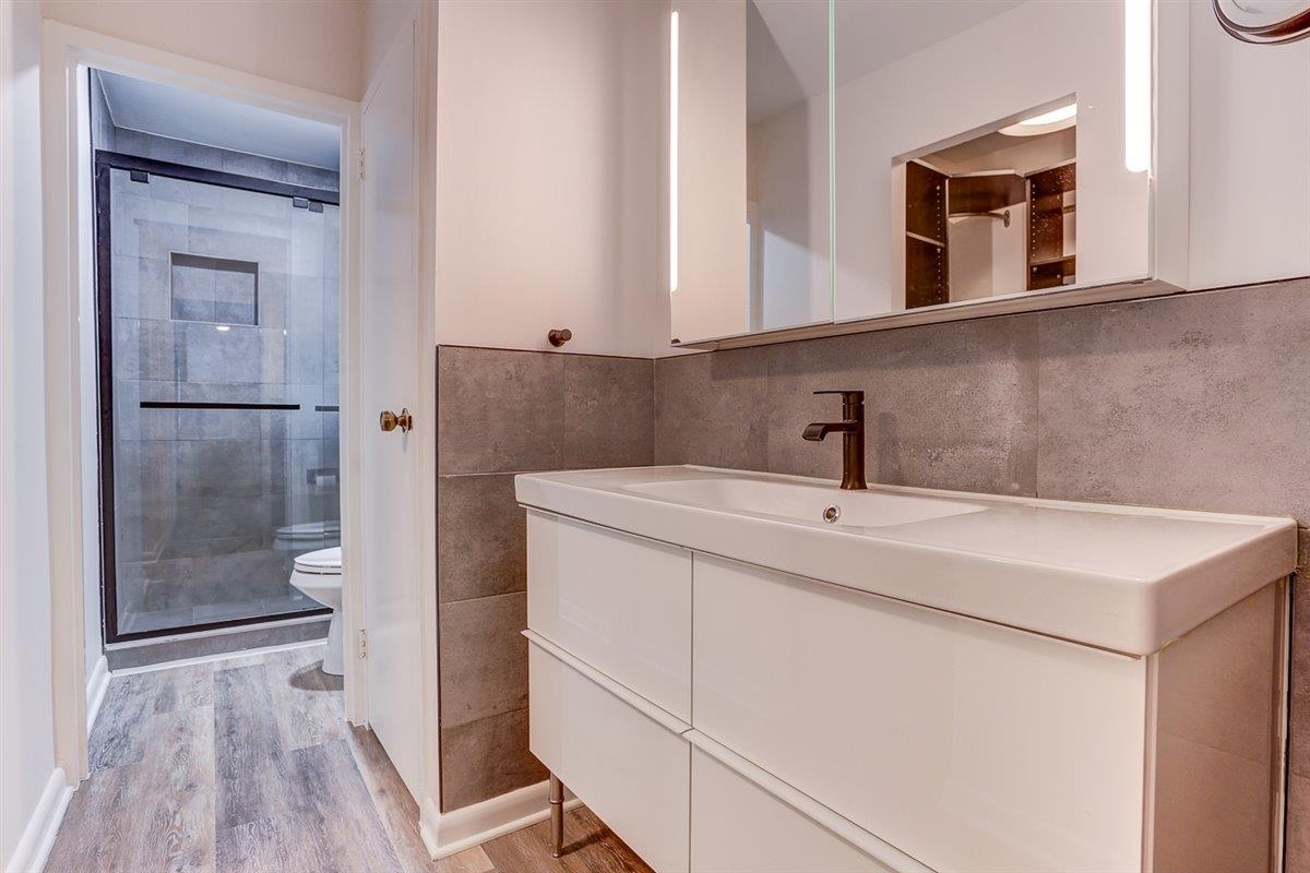 232 South Highland Street, Unit 409 Memphis, TN 38111 - Photo 23 of 39 a bathroom with a sink a toilet and shower