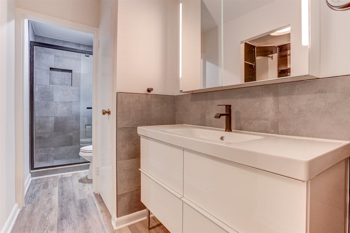 232 South Highland Street, Unit 409 Memphis, TN 38111 - Photo 24 of 39 a bathroom with a sink a toilet and shower