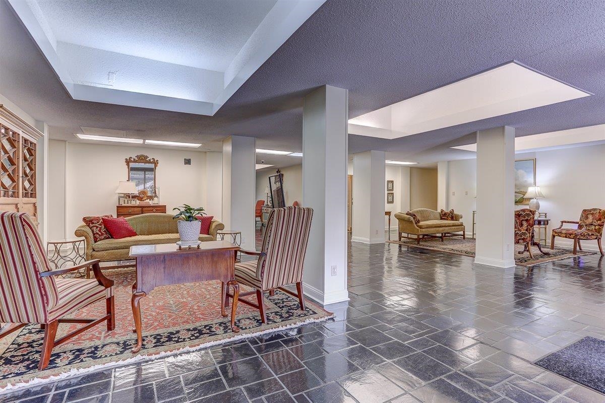 232 South Highland Street, Unit 409 Memphis, TN 38111 - Photo 31 of 39 a living room with furniture a dining table and a potted plant