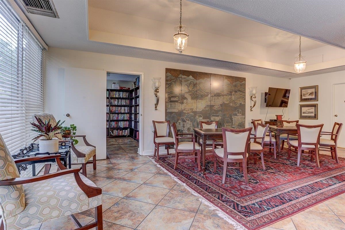 232 South Highland Street, Unit 409 Memphis, TN 38111 - Photo 34 of 39 a living room with furniture a dining table and a potted plant
