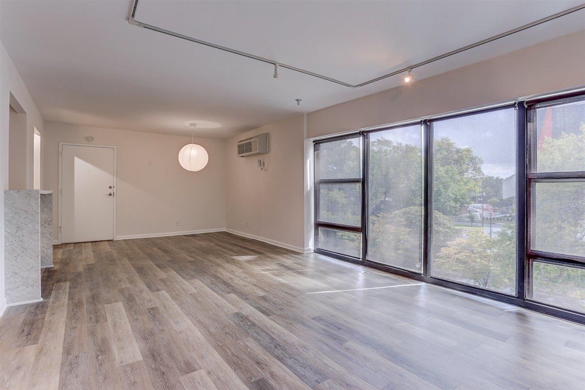 232 South Highland Street, Unit 409 Memphis, TN 38111 - Photo 7 of 39 wooden floor in an empty room with a window