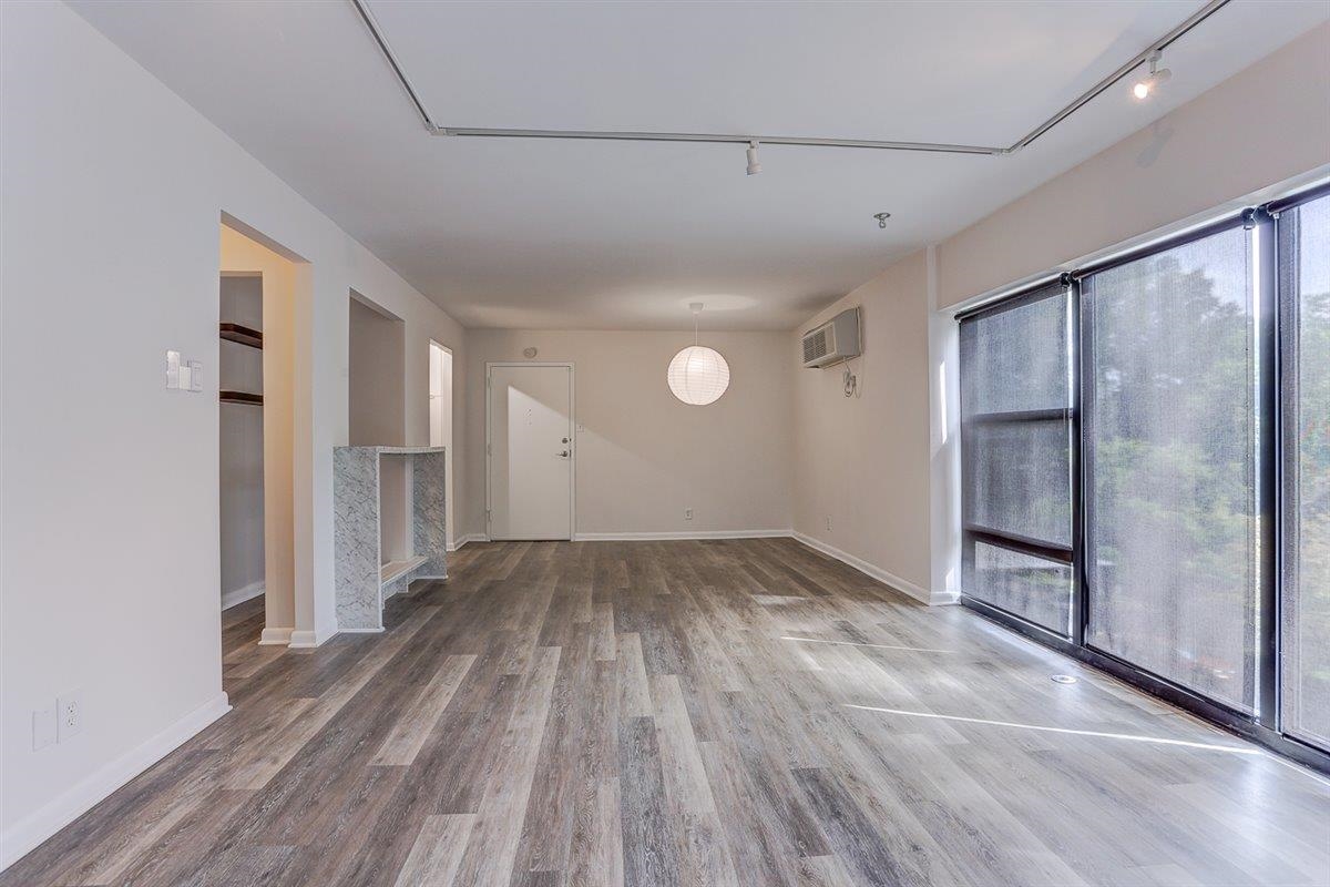 232 South Highland Street, Unit 409 Memphis, TN 38111 - Photo 9 of 39 a view of empty room with wooden floor