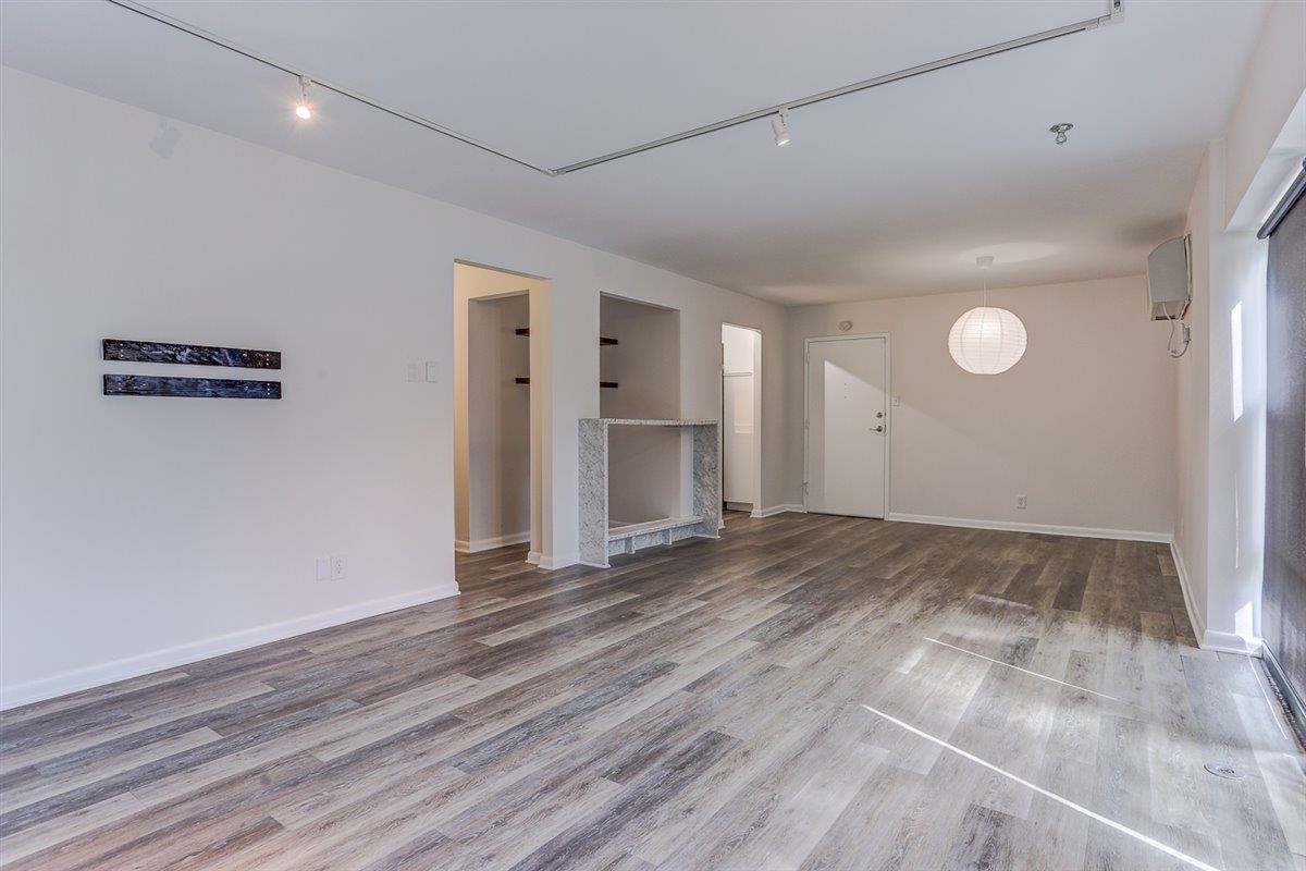 232 South Highland Street, Unit 409 Memphis, TN 38111 - Photo 10 of 39 a view of empty room with wooden floor