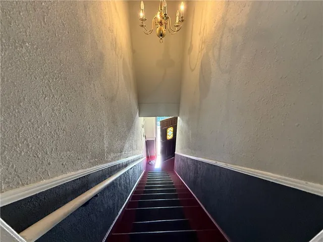 a view of a swimming pool next to a yard