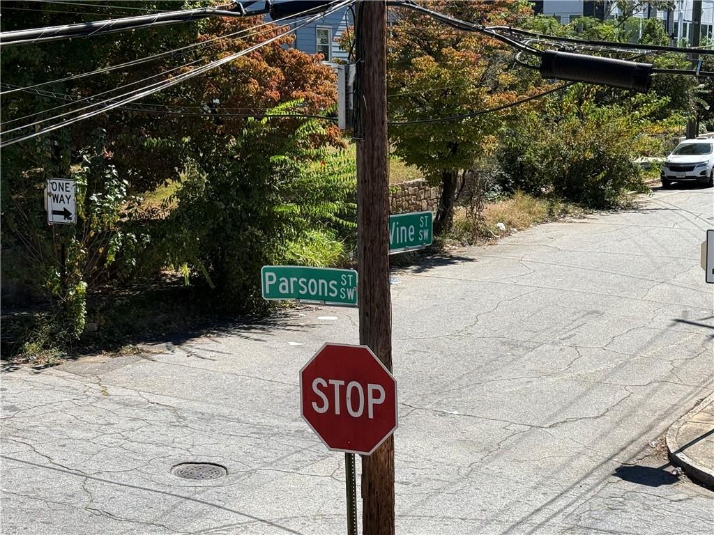 117 Vine Street Southwest, Unit B Atlanta, GA 30314 - Photo 22 of 22 a street sign on a sidewalk next to a road