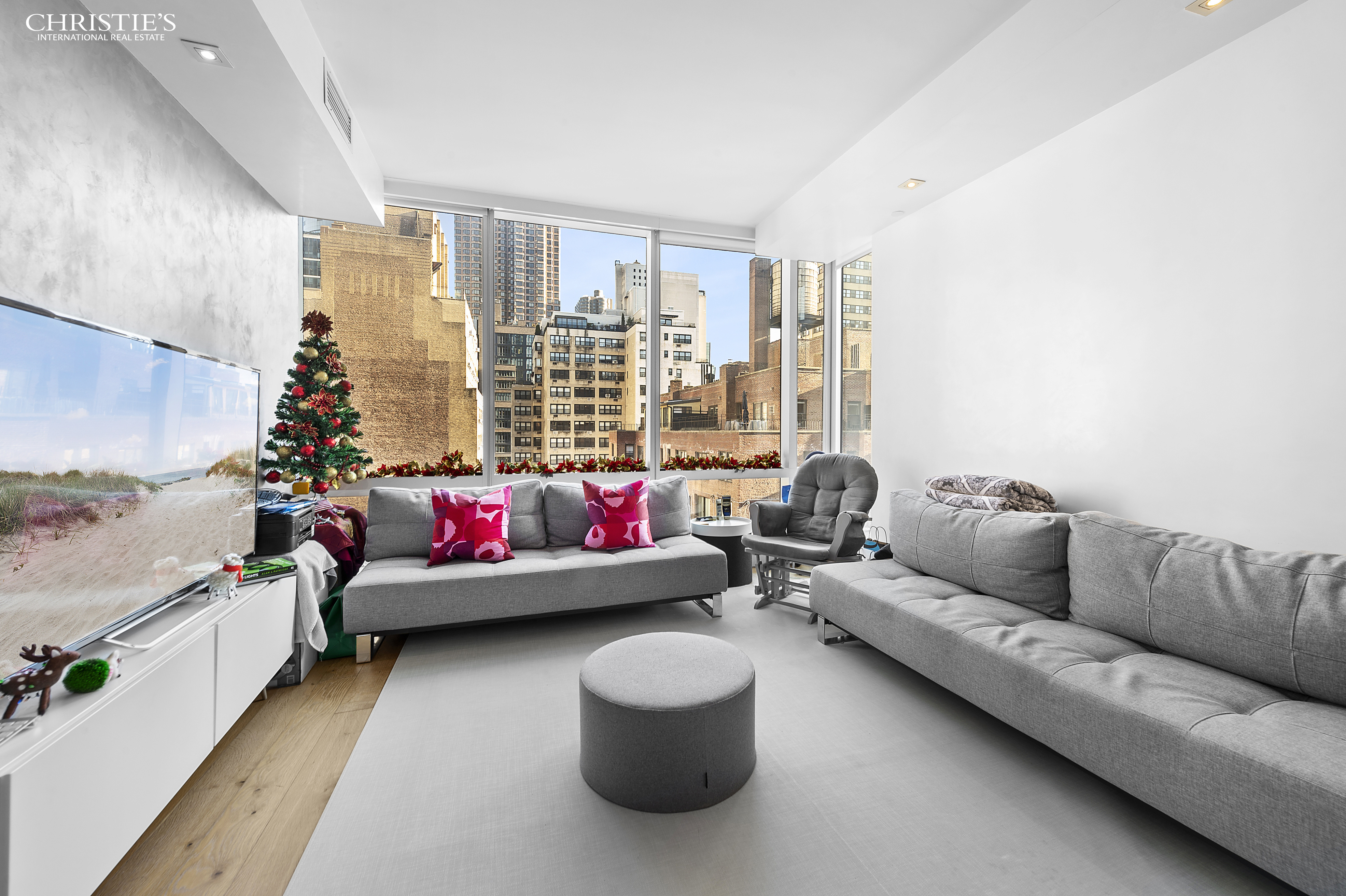 325 Lexington Avenue, Unit 11E Manhattan, NY 10016 - Photo 1 of 11 a living room with furniture and a couch