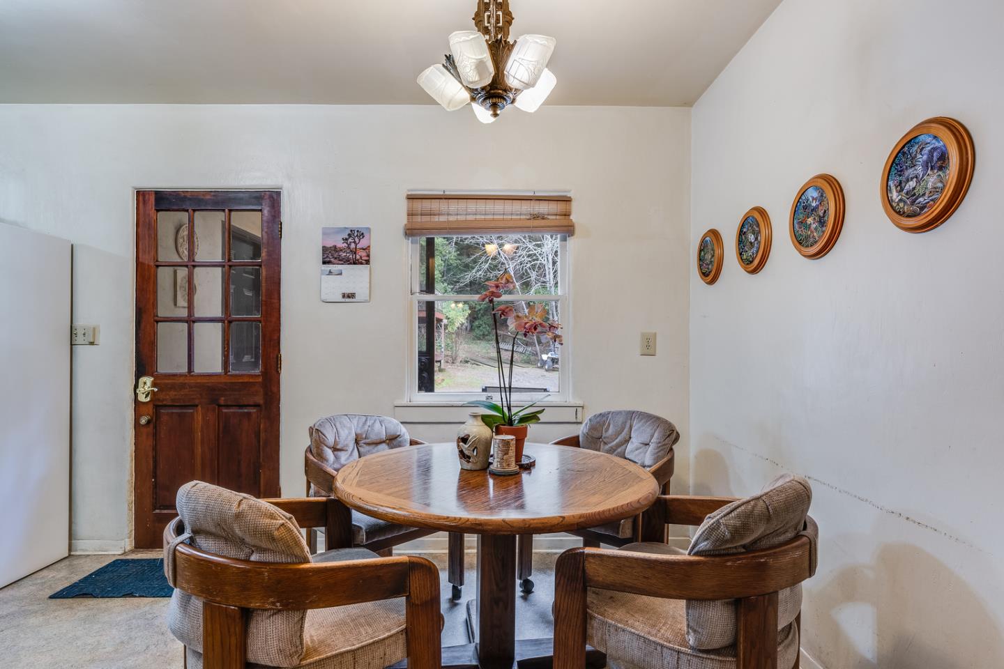 22200 Aldercroft Heights Road Los Gatos, CA 95033 - Photo 12 of 45 a view of a dining room with furniture and a chandelier